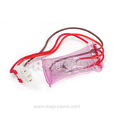 A pink 3-wire bimetal component with wires connected to it for LG refrigerator