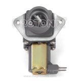 A top-load washing machine water inlet valve with visible metallic parts and connectors