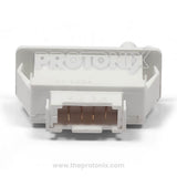 Close-up of 4-pin door switch for LG refrigerator with installation pins