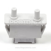 Top view of 4-pin door switch for LG refrigerator showing smooth finish