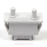 Top view of 4-pin door switch for LG refrigerator showing smooth finish