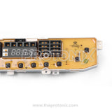 Close-up of LG top-load 10-button PCB (EBR62105301, 9kg) showing relays, connectors, and power section