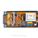 Close-up of universal top-load washing machine PCB YM200 highlighting capacitor and relay section
