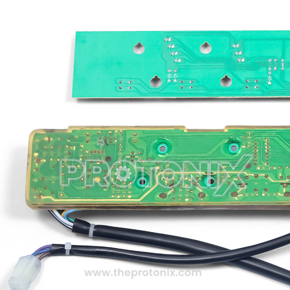 Close-up of strong green board of Whirlpool 6th Sense top-load PCB with wires